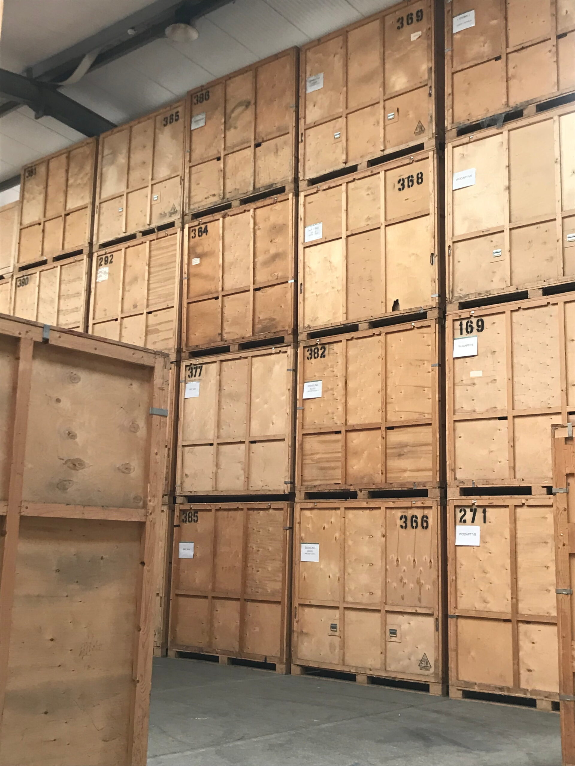 Stacked wooden storage crates in secure long-term warehouse storage