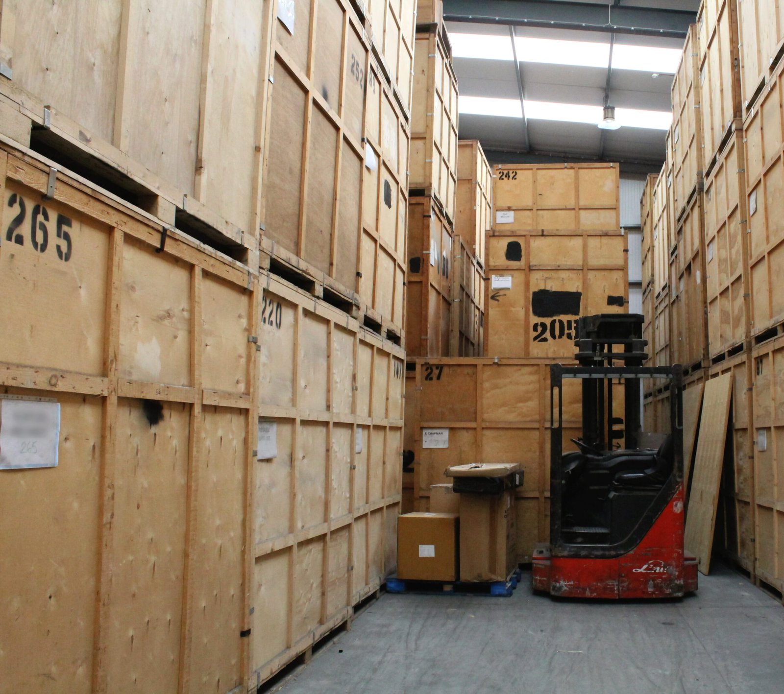 Forklift access aisle within secure managed storage warehouse