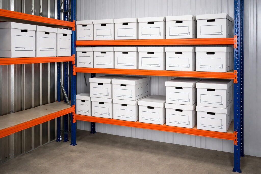 Document Archiving White archive storage boxes organised on secure warehouse shelving for document archiving