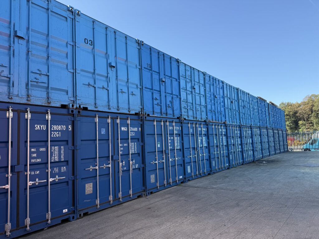Stacked steel storage containers at secure Essex storage facility